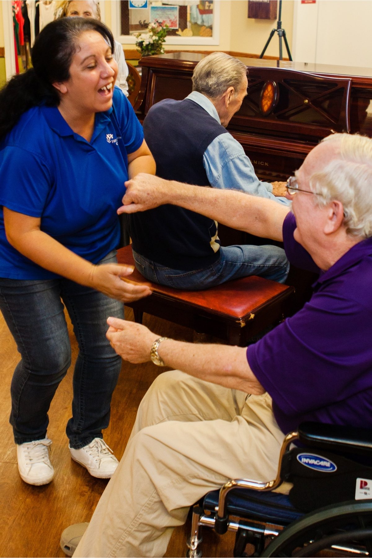 Someren Glen Senior Living Community in Centennial, CO - resident dancing with team member portrait